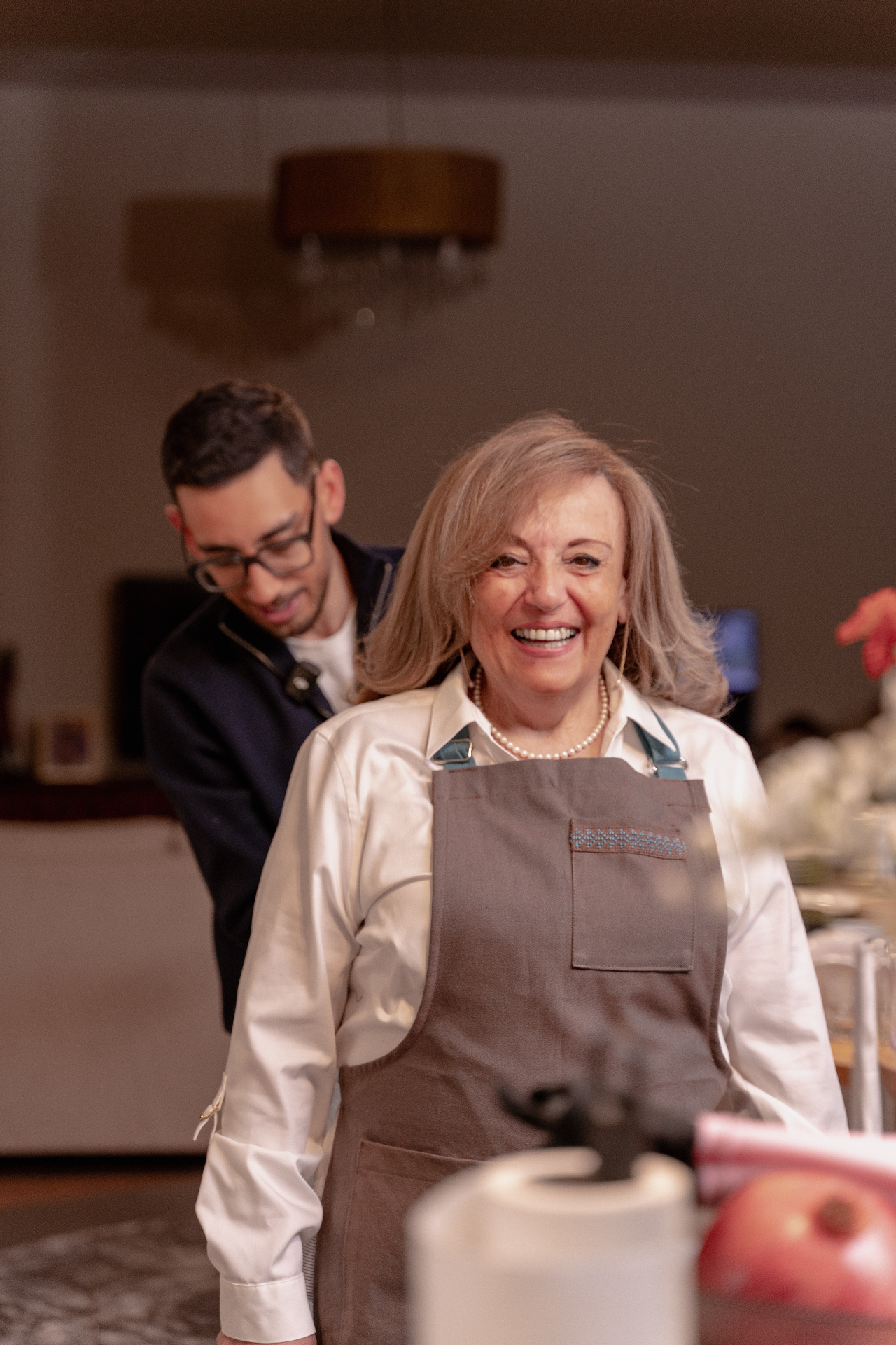 Mother and son shaping dough