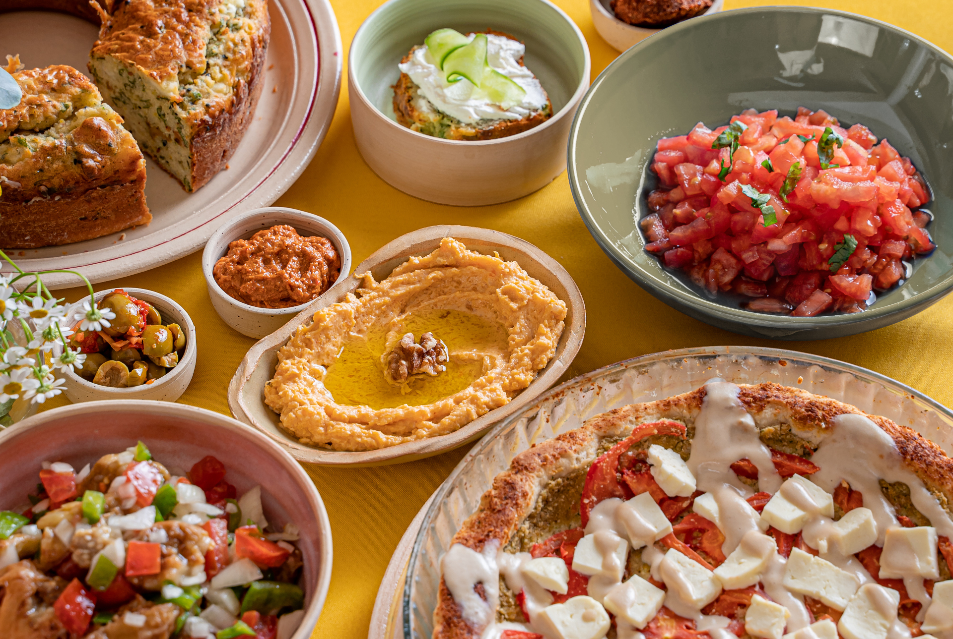 Palestinian brunch spread of dips, salads, and pastries